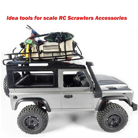 Model RC crawler with assorted mini bungee cords and rooftop gear for small item securing and travel use.