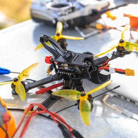 RC drone with visible silent, reliable RC vibration dampers that isolate the flight controller and gimbal, fits F4/F7 mounts.