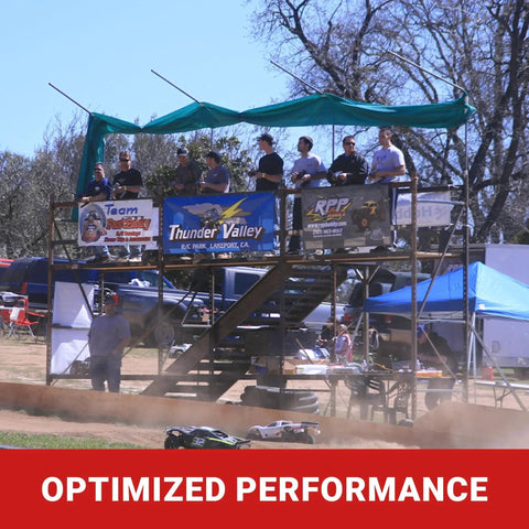 People standing on RC race control tower observing remote control cars on dirt track at Thunder Valley, Lakeport, California.