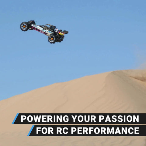RC truck jumping over sand dune with 'Powering Your Passion for RC Performance' text, showcasing Axial SCX6 Trail Honcho Sealed Bearing Kit Upgrade.