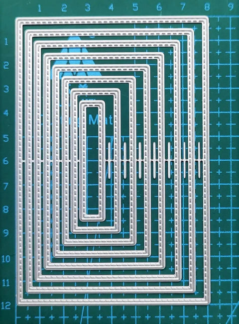 8 Piece Rectangle Cutting Die Set For Scrapbooking And Card Making Includes Eight Size Options 12x8cm to 5x1cm on green mat