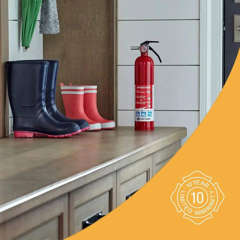 Image of Home Fire Extinguisher UL Rated 1A 10B C Multipurpose Unit With All Metal Construction placed on a countertop next to boots.