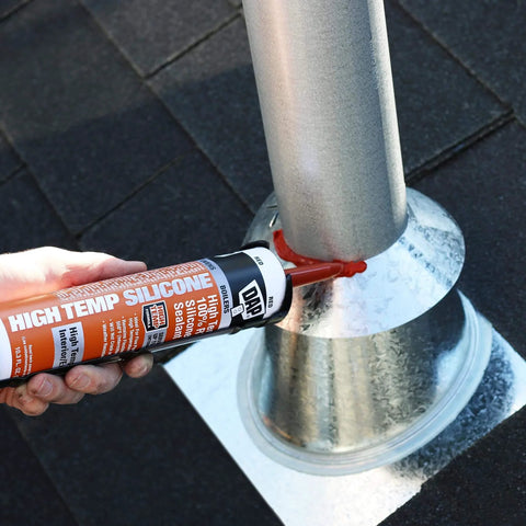 Heavy-Duty High Temp 100 Percent RTV Silicone Sealant Red 10.3 Oz being applied to metal pipe flange