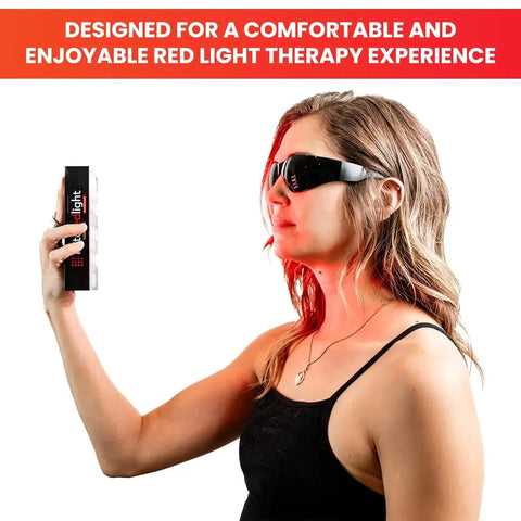 Woman wearing Red Light Therapy Glasses With Eye Protection 600-900nm For Safe Use, holding a red light device.