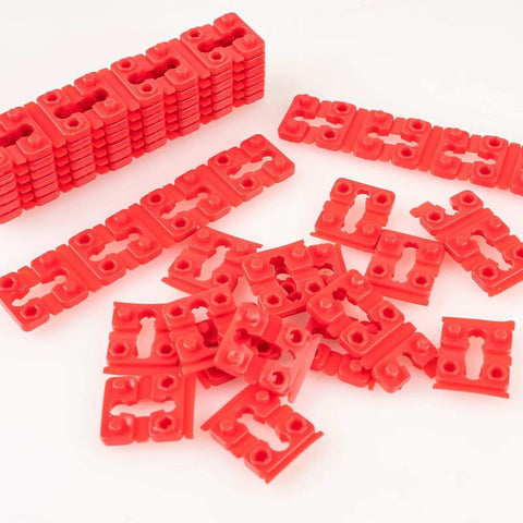 Red plastic pieces from Outlet Box Spacers Kit 48 Pack for Loose Outlets and Switches, Wall Plate Stabilizers, Tile Backsplash Extenders