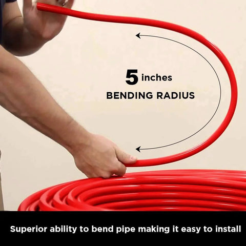 Person demonstrating 5-inch bending radius of Pex A Tubing 1 Inch 100 Ft Coil Red Non Barrier Flexible PEX Pipe for potable water.