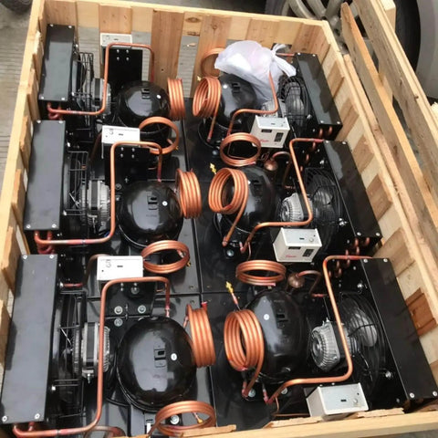 Crate of HVAC components with copper parts, illustrating Refrigerator Filter Dryer With Access And Service Valve And Three In One HVAC Tool Kit