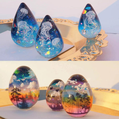 Mini Egg And Waterdrop Silicone Molds Set showing resin jewelry with jellyfish and forest designs