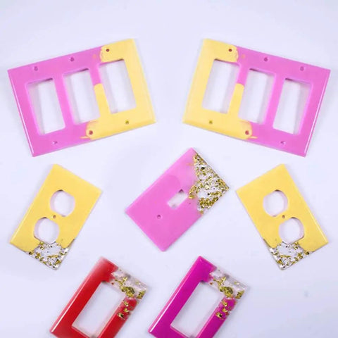 Colorful epoxy resin light switch and outlet covers made with 7 Piece Light Switch Cover Resin Molds Set for Epoxy Resin Crafts.