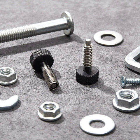Hand Retractable Spring Plunger With Knurled Handle M6 Quick Release Pins and nuts on gray surface