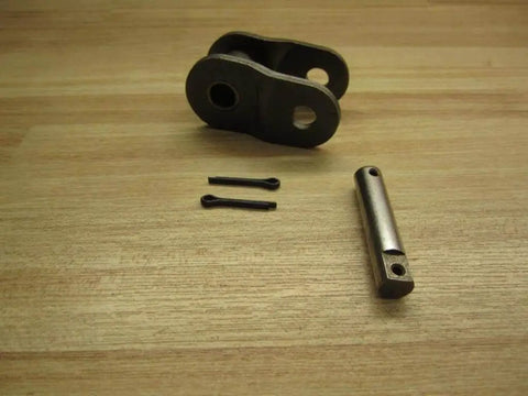 Offset Link For Rex100 Drive System Replacement Part REX100 OFPK By Rexnord laid out on wooden surface, showing components.