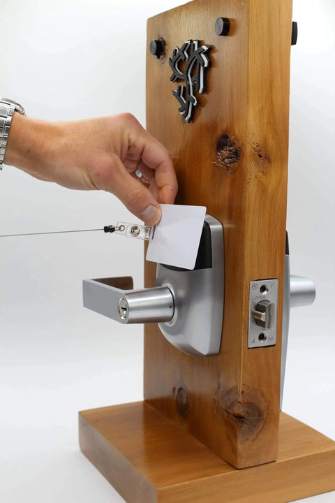 Demonstrating RFID Commercial Lever Door Lock With App Access Control And Includes 2 NFC Keycards Left Hand on wooden block.