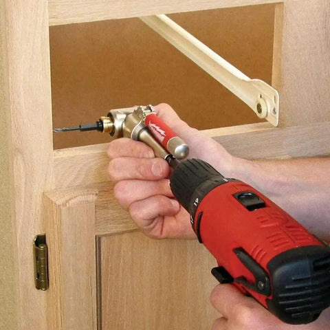 Person using One Quarter Inch 90 Degree Angle Offset Power Groove Drive Adapter 49-22-8510 for right angle drilling in cabinetry