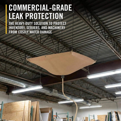 Commercial-grade roof leak protection system installed in warehouse with drainage system to divert leaks and protect inventory.