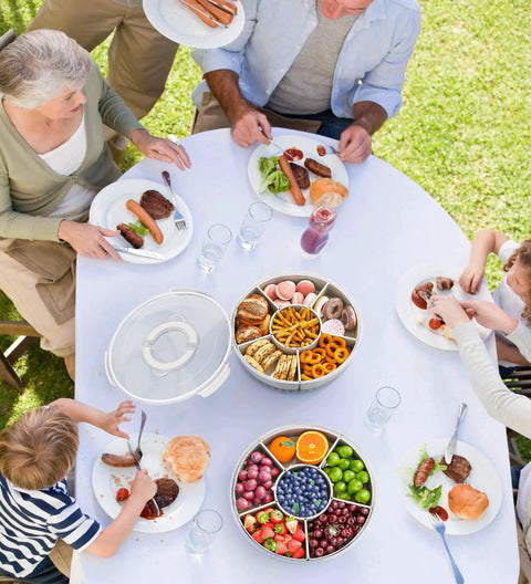 Family picnic using Divided Rotating Serving Tray With Lid And Handle 12 Inch Clear Lazy Susan Organizer for snacks and fruits.