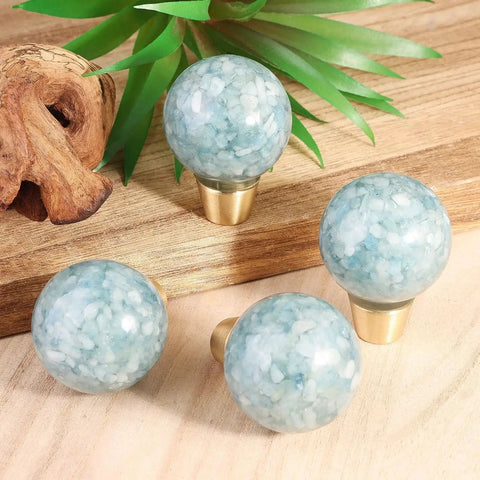 Pack of 2 Round Resin Aquamarine Drawer Knobs With Screws, Ball Shape Crystal Pulls for kitchen decor on wooden surface