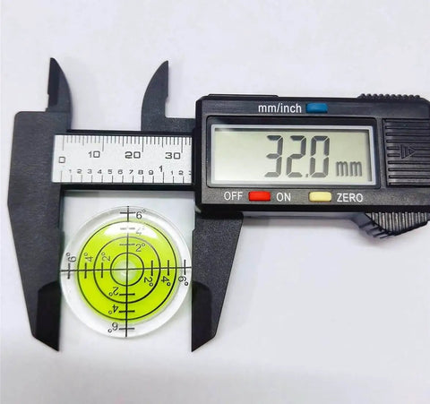 Digital caliper measuring 32mm circular yellow green spirit level from Six Piece Round Bubble Level Set Handy Pro Grade High Quality Circular Spirit Levels 32mm Diameter 7mm Height Yellow Green Color With Degree Markings For Precise Layout And Measuring For Woodworking And Construction