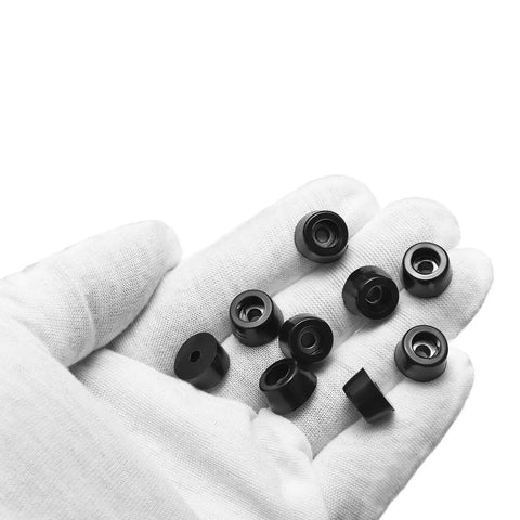 10 Pack Round Rubber Bumper Feet With Stainless Steel Washer And M3x10mm Phillips Screws held in gloved hand
