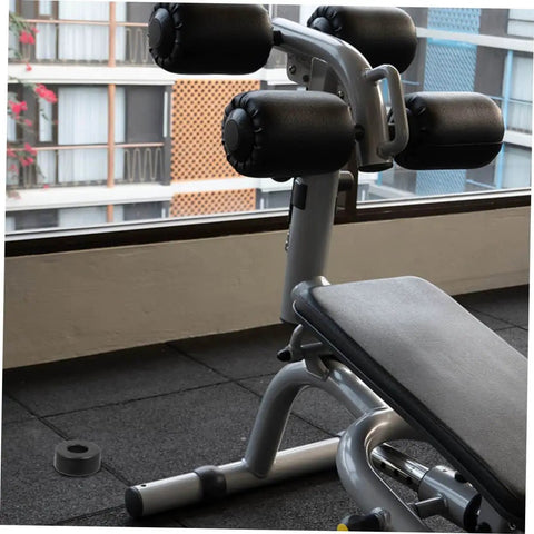 Weightlifting bench with Four Pack Round Rubber Bumpers for Gym Equipment and Home Fitness Machines on the floor.