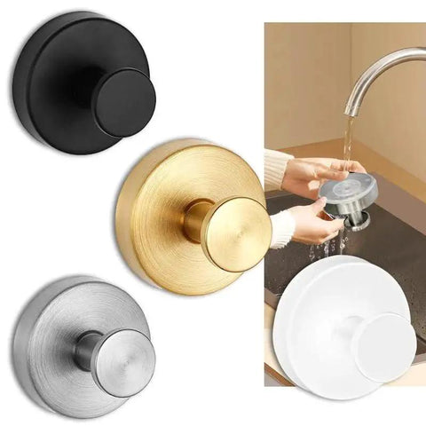 Set of black, gold, silver, and white round kitchen drain plugs with hand washing one under tap
