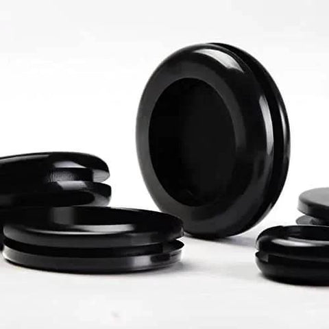 Close-up of black rubber grommets from 188 Piece Rubber Grommet Kit For Wiring Electrical Plumbing Round Hole Seals Waterproof Insulation And Wire Protection.