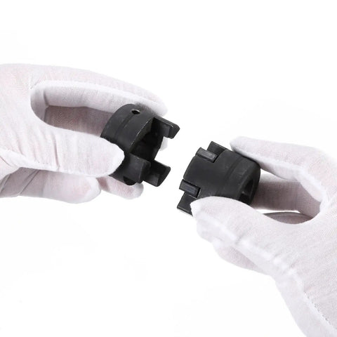 Person holding Flexible Three Piece L Jaw Coupling Set With Buna N Rubber Spider One Half Inch To Five Eighth Inch Bore