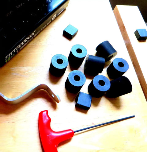 Premium 4-Pack Rubber Spacers For Anti-Vibration And Mounting, IZZY USA LLC, various spacers on a wooden surface with tools