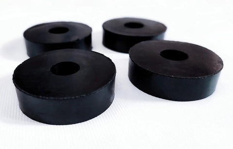 Four Pack Rubber Isolation Feet Pads For Vibration Damping, 1.5 Inch Outer Diameter, 0.5 Inch Inner Diameter, 0.4 Inch Thick, shown on surface