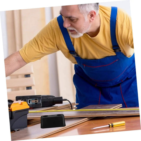 Man in workshop setting with rubber vibration isolation pad on table, used for washing machines and generators heavy duty anti vibration pad shock absorbing.