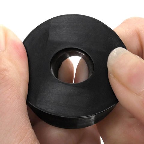 Close-up of a durable rubber washer being held, showing size 1.5 in OD, 0.5 in ID. Used for vibration damping and quiet operation.