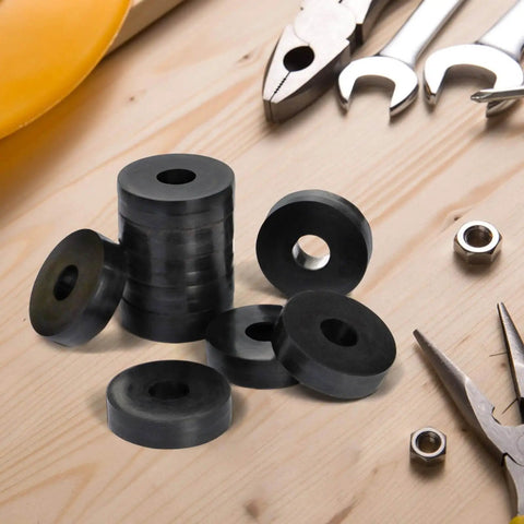 Durable rubber washers set delivers reliable vibration damping and quiet operation for machines, motors, and mounts; includes 30 flat washers sized 1.5 in OD, 0.5 in ID, 0.375 in thick for spacer and isolation needs. Displayed on a wooden surface with tools.