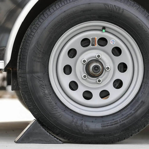 Beefy Rubber Wheel Chock For Cars Trailers RVs And Utility Vehicles With Reinforced Grip Weather And Chemical Resistant 5x6x5 Inch Tire Stopper For Secure Parking And Service Bays Buyers Products WC1467A securing vehicle tire.