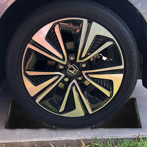 Heavy Duty Rubber Wheel Chocks 4 Pack For Trailers And RVs Ideal For Cars Travel Trailers Trucks And ATVs 6.3 X 4 X 4 Inches UV And Oil Resistant All Weather Black Chocks By CertBuy, visible securing a car wheel