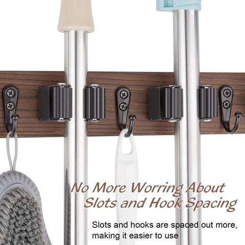 Rustic Wood Wall Mount Mop And Broom Organizer With 4 Slots And 4 Hooks, holding cleaning tools. Ideal for closet, garage, or kitchen use.