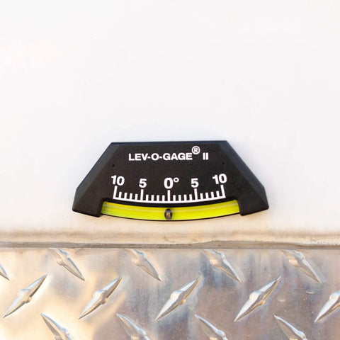 Lev O Gage II RV Leveling System 2 Pack Made In USA High Visibility Brass Ball Level For RV Camper And Pop Up Trailer No Bubble Tilt Readings From Minus Ten To Plus Ten Degrees Sun Company mounted on metal surface