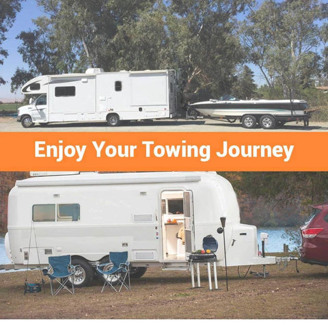 Two parked RVs, one towing a boat and one with camping setup, in a forested area under clear skies.