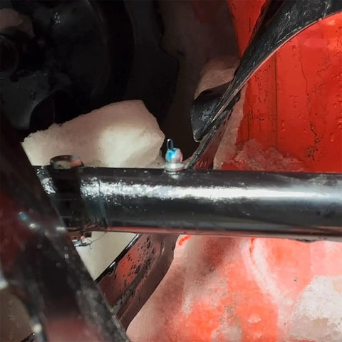 Close-up of installed grease fitting from 80 Piece SAE Grease Fittings Set With Common 1/8 NPT And 1/4-28 Threads in icy environment.
