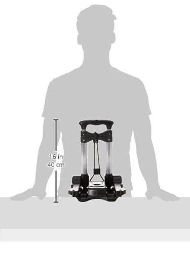 Silhouette of person holding Samsonite Compact Folding Luggage Cart, Black, One Size, showing 16-inch height with handle.