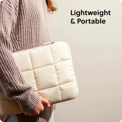 Person holding Nylon Puffy Zipping Laptop Sleeve 9.75 By 13 Inches Fits Most Screens Up To 14 Inches With Plush Lining, Sand Beige