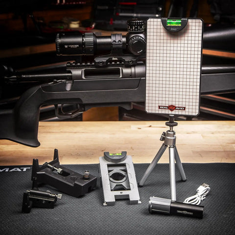 Complete Scope Mounting Kit And Precision Leveling System For Rifles with leveling grid, tripod, and rifle scope setup.