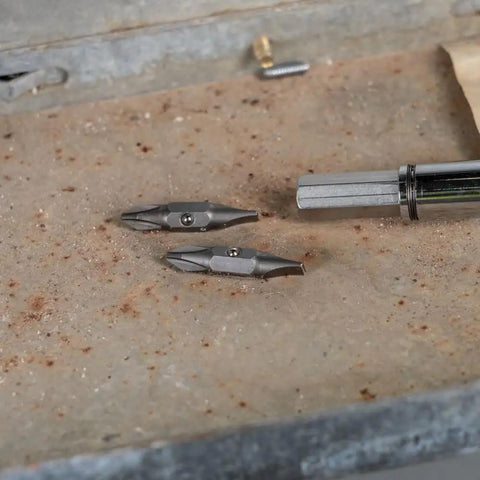 Replacement Bit For 11-In-1 And 10-In-1 Screwdriver Nut Drivers Includes Number 2 Phillips And 1/4 Inch Slotted Tips on workbench