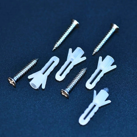 Close-up of white plugs and silver screws from the Mirror Hanger Clips Set For Unframed Mirrors Eight Pieces Spring Loaded Metal Clips With Screws And Plugs Supports Up To Ten Kilograms Six Millimeter Thickness Limit And Five Millimeter Bracket Depth Durable Wall Mount Hardware.