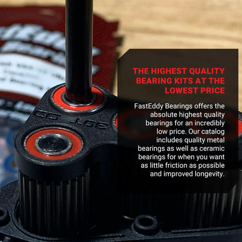 Close-up of FastEddy Bearings component with red seals, shown on a black RC part.