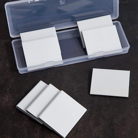 Self-adhesive door corner seals, white foam, 8 pcs in a clear plastic case.
