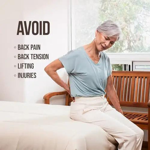 Elderly woman sitting on bed holding her lower back, highlighting the need for the Bed Sheet Tucker Mattress Lifter Tool Made From Sturdy Acacia Wood That Helps You Change Sheets Without Strain Back Saver Works With Fitted And Flat Sheets Comforters And Blankets.