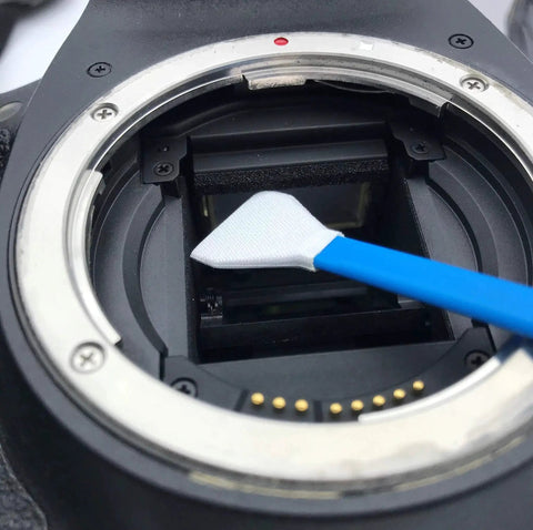Close-up of Full Frame Sensor Cleaning Swabs 24mm For DSLRs And SLRs 20 Pack HCS 24 cleaning a camera sensor