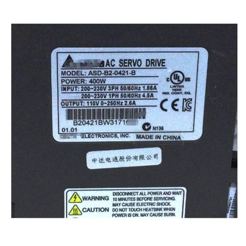 Label on Servo Drive 400W ASD-B2-0421-B Sealed in Box 1 Year Warranty Fast showing model, power, and input-output details.