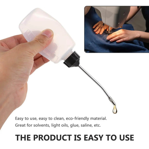 Hand holding Three Piece Sewing Machine Oil Can Set With Iron Spout And Cap For Precise Lubrication On Sewing Machines