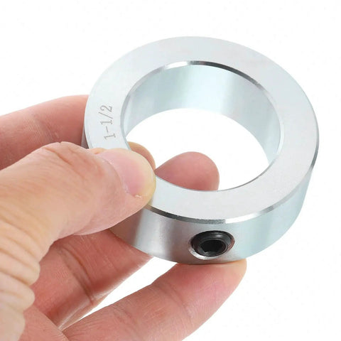 Close-up of Four Piece Set Screw Shaft Collars By Uxcell, one and a half inch bore, zinc plated heavy duty carbon steel for linear rod guides.