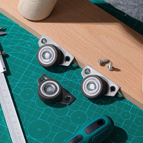 20 Set 1.25 Inch Side Mount Caster Wheels With Screws, visible on a workbench; non-swivel, ideal for wooden furniture projects